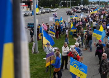 Alaskans greet Putin with Ukrainian flags, protest ‘war criminal hanging out here’