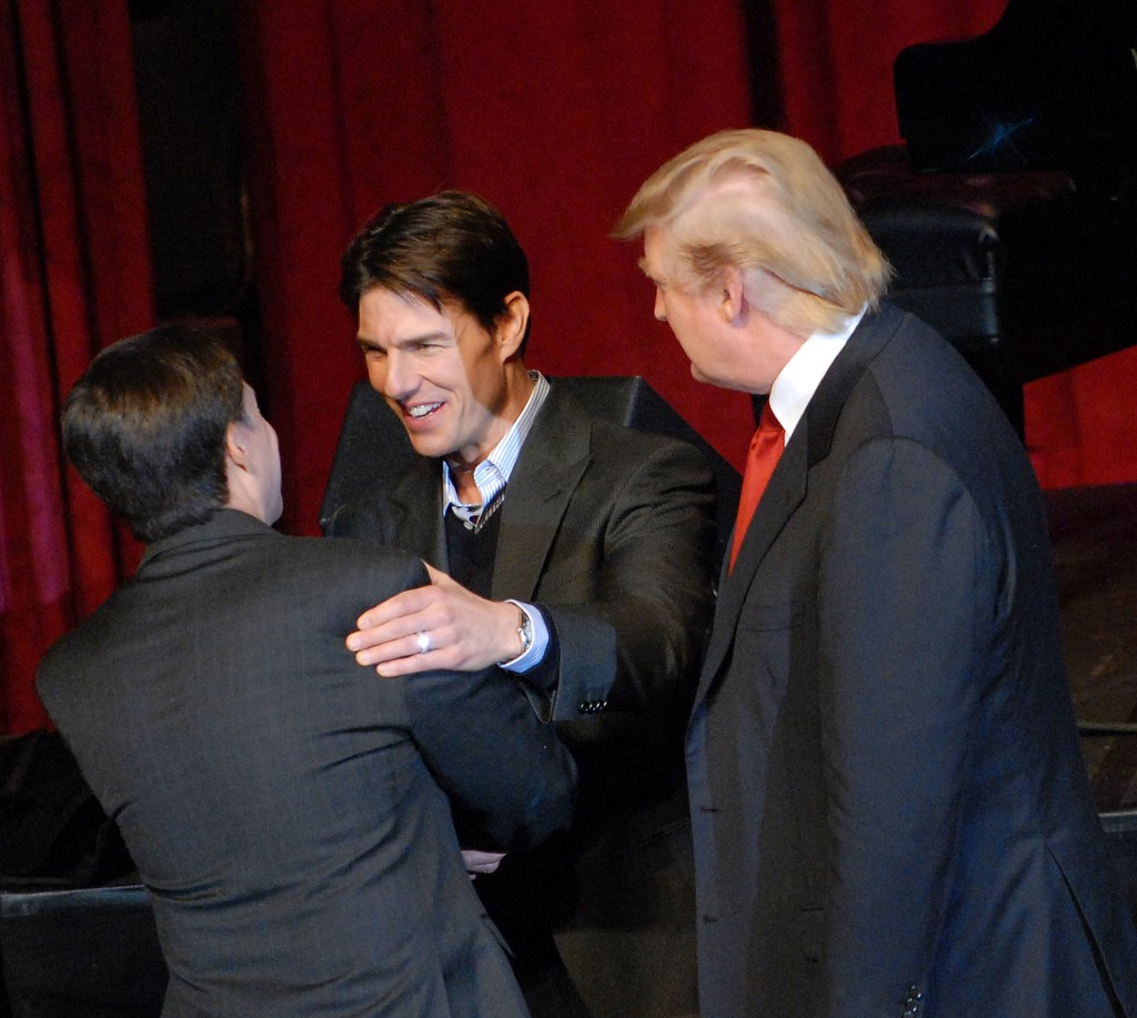 Tom Cruise and President Donald Trump shake hands with Bob Costas at the New York Hilton on Oct. 24, 2008.