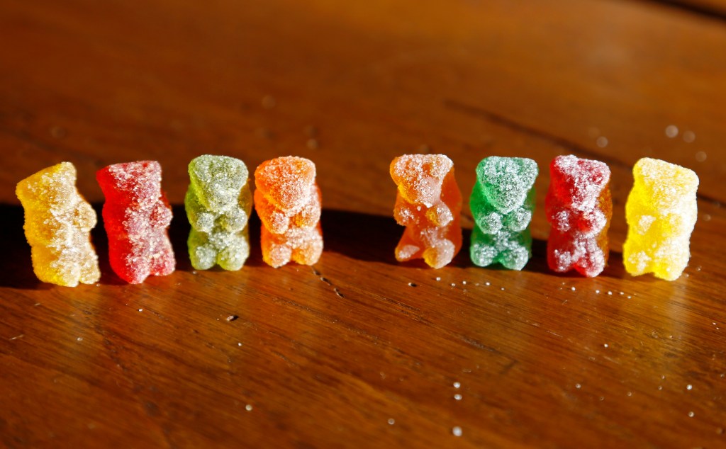 Marijuana-infused sour gummy bear candies lined up in a photo illustration.