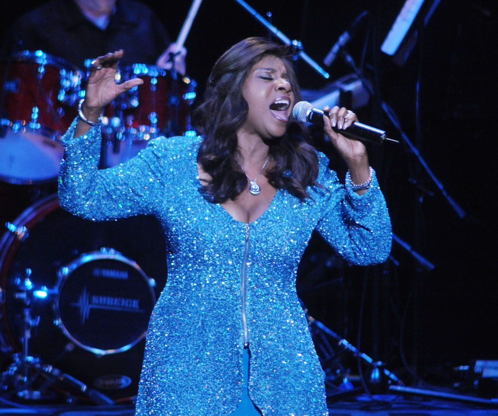 Gloria Gaynor performing on stage.