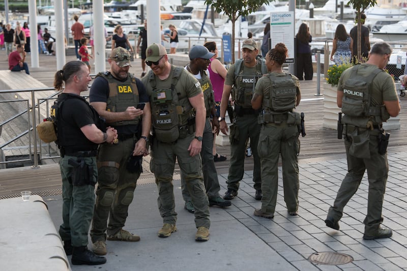 Drug Enforcement Agents walk along The Wharf on August 14, 2025 in Washington, DC.