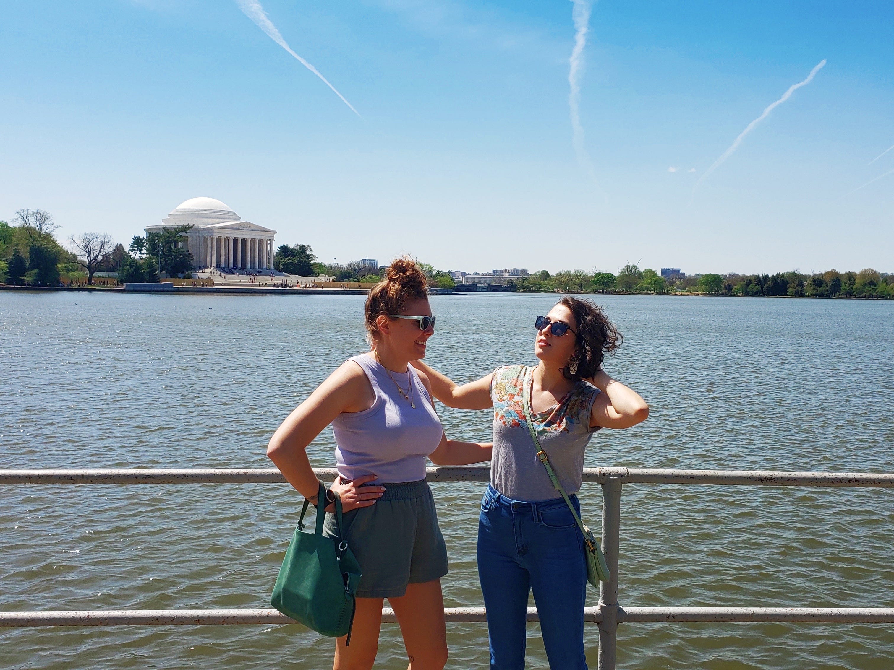 The author and her friend posing in front of the Tidal Basin and the Jefferson Memorial in Washington, DC.