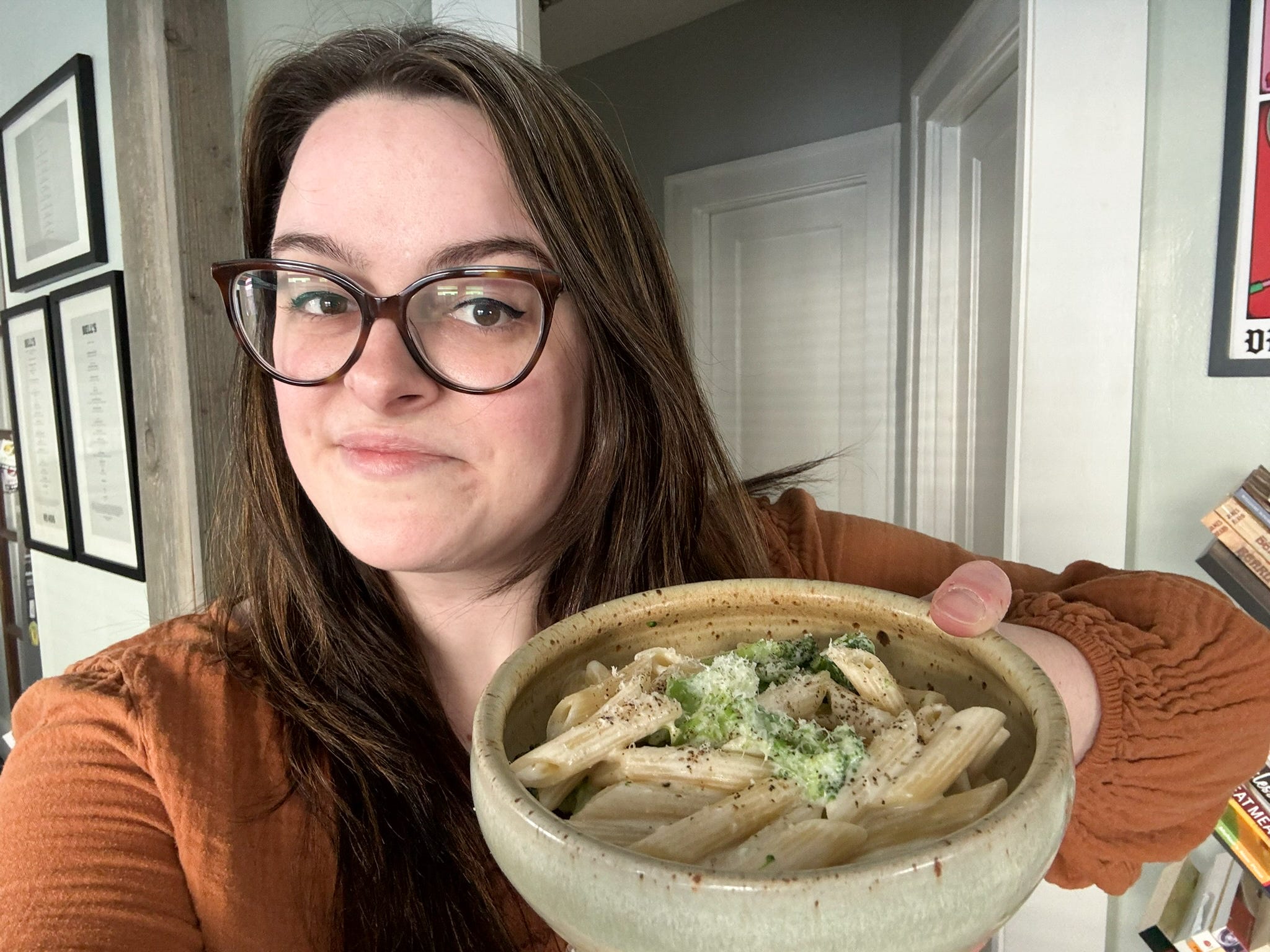 The author holding her bowl of mac and cheese.