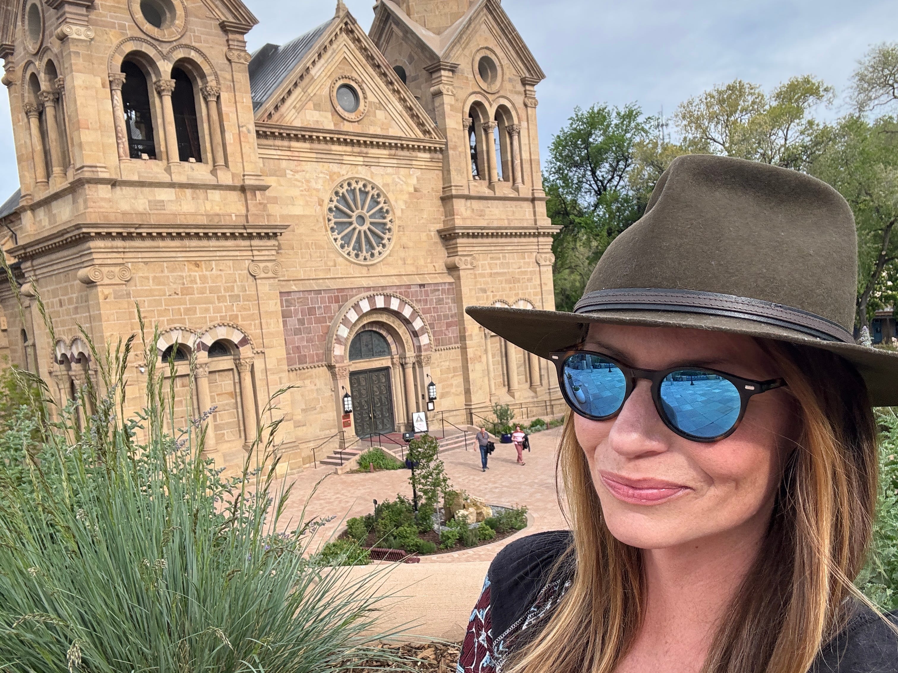 Emily taking a selfie in front of the Cathedral Basilica of St. Francis of Assisi in Santa Fe.