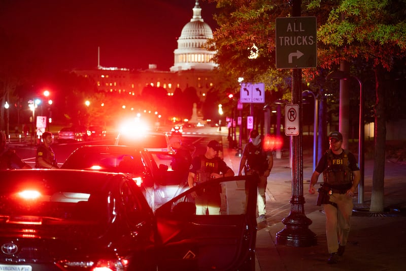 Federal Bureau of Investigation and Metropolitan Police Department officers conduct a traffic stop near the U.S. Capitol on August 14, 2025 in Washington, D.C.