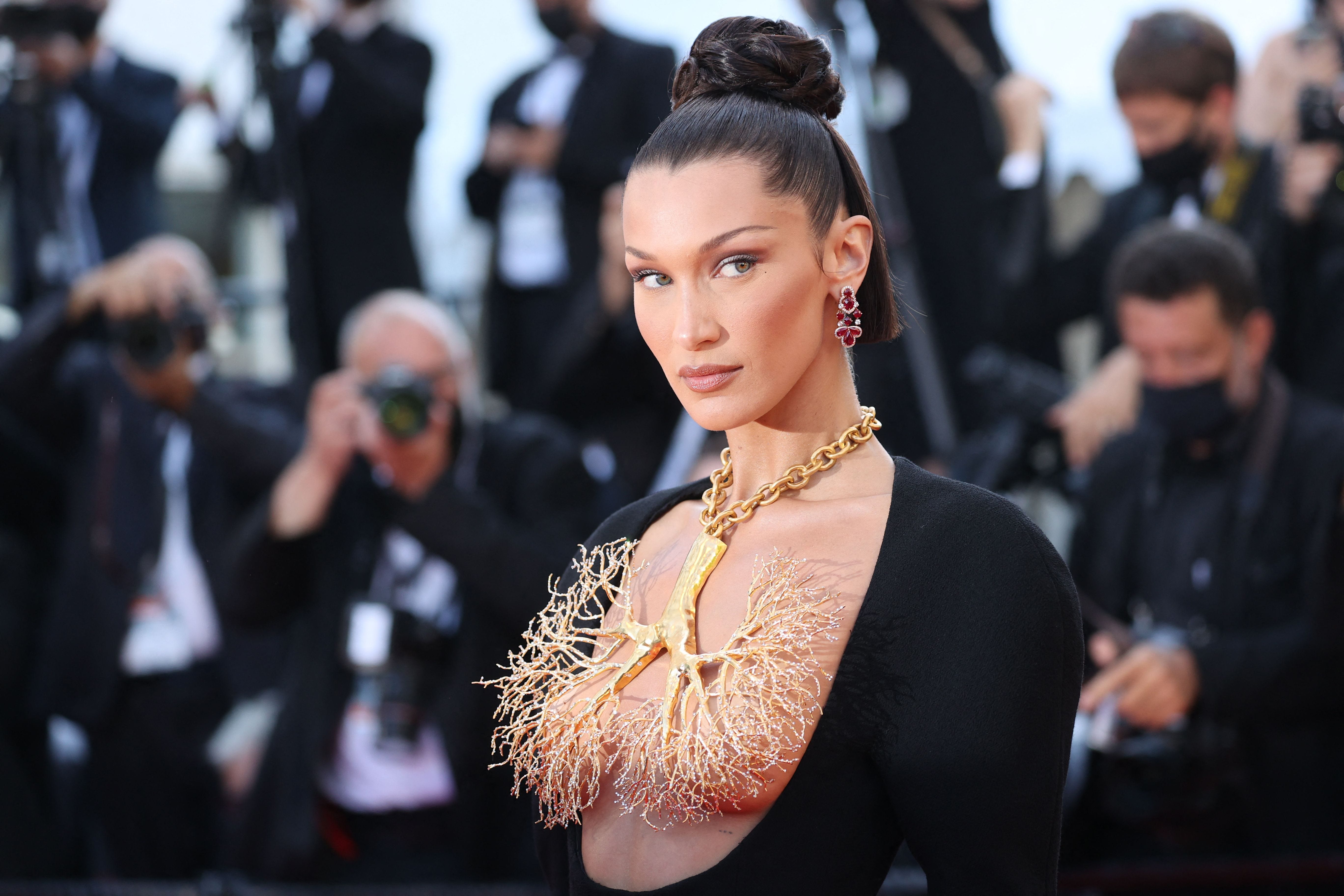 US model Bella Hadid poses as she arrives for the screening of the film "Tre Piani" (Three Floors) at the 74th edition of the Cannes Film Festival in Cannes, southern France, on July 11, 2021