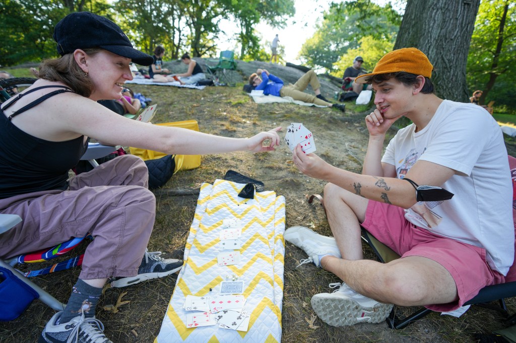 Liam Collier, age 31 and Corinne Hastings, age 32  play cards.