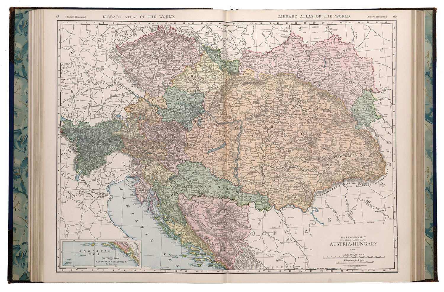 A map of Austria Hungary inside a large atlas book.