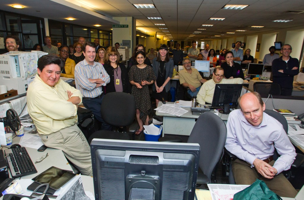 Group photo of Myron Rushetzky's retirement party at the New York Post newsroom.