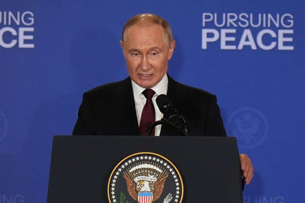 Russia's President Vladimir Putin speaks during a joint press conference with President Donald Trump at Joint Base Elmendorf-Richardson, Alaska, on Aug. 15, 2025. 