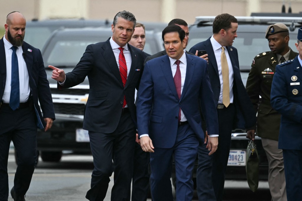 Pete Hegseth and Marco Rubio walking at Joint Base Elmendorf-Richardson.