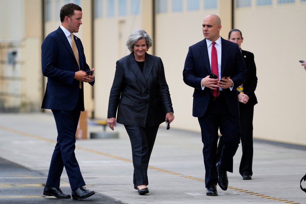 Susie Wiles and James Blair walking before President Trump's meeting with President Putin.