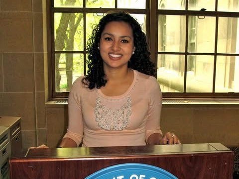 Giovanna Gonzalez is standing at a podium that has a Department of Commerce badge.