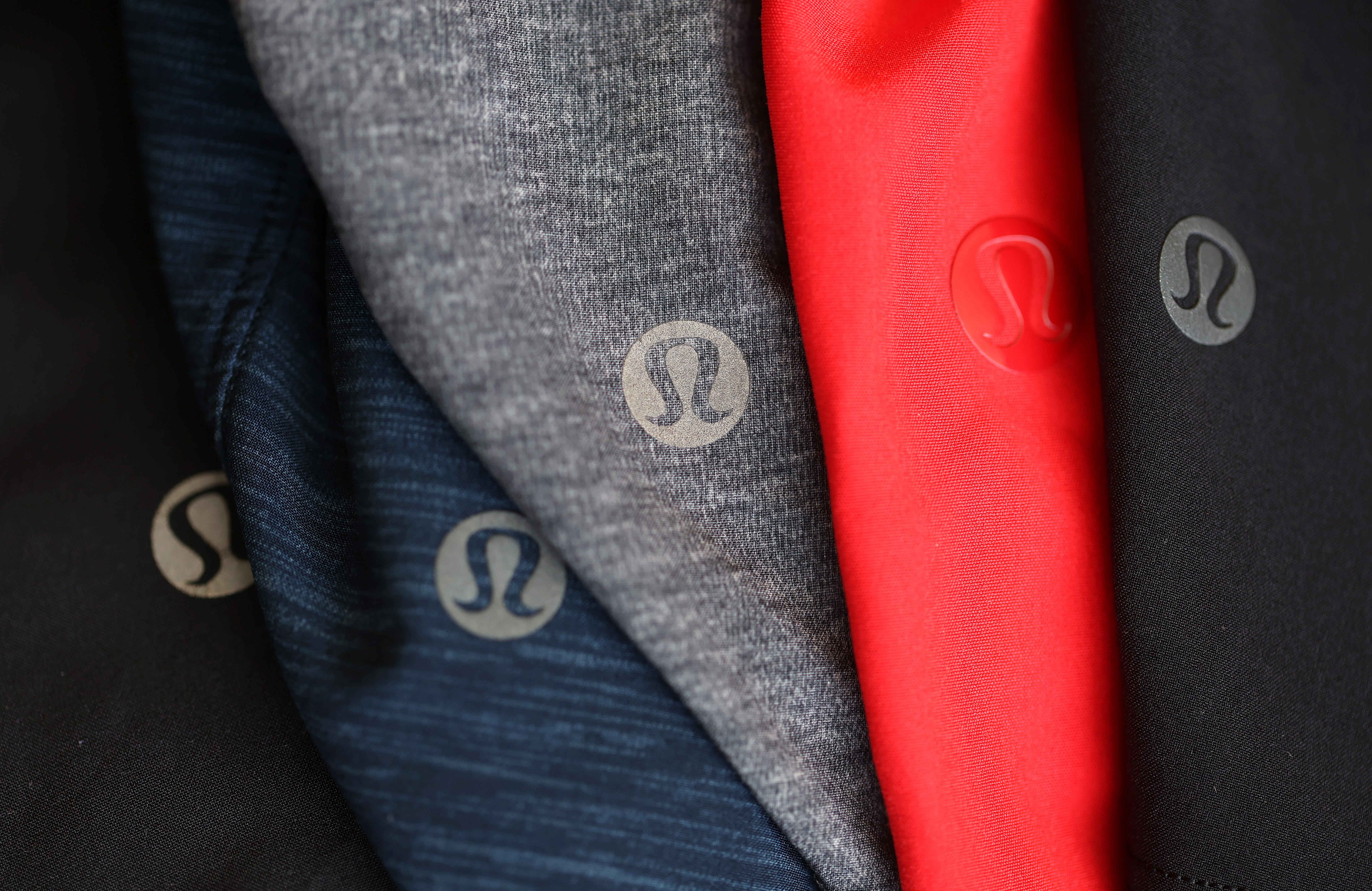 The Lululemon logo is seen on five garments of different colors.