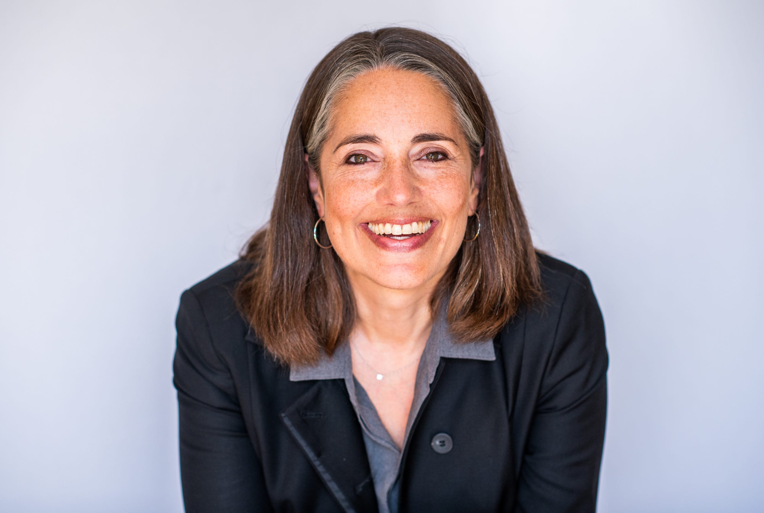 Brieanne Yuchasz poses for a photograph, wearing a blazer