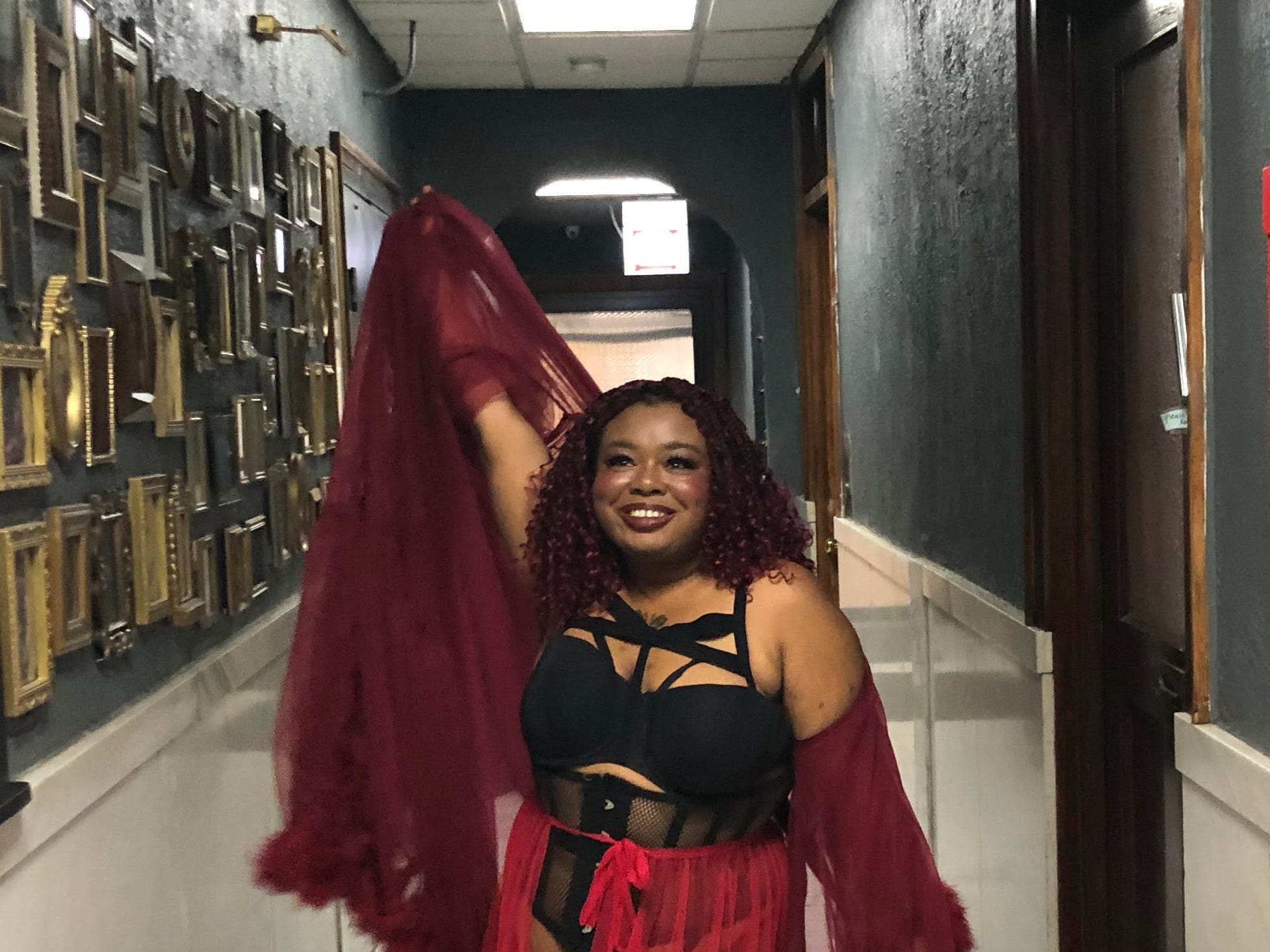woman in red and black burlesque attire