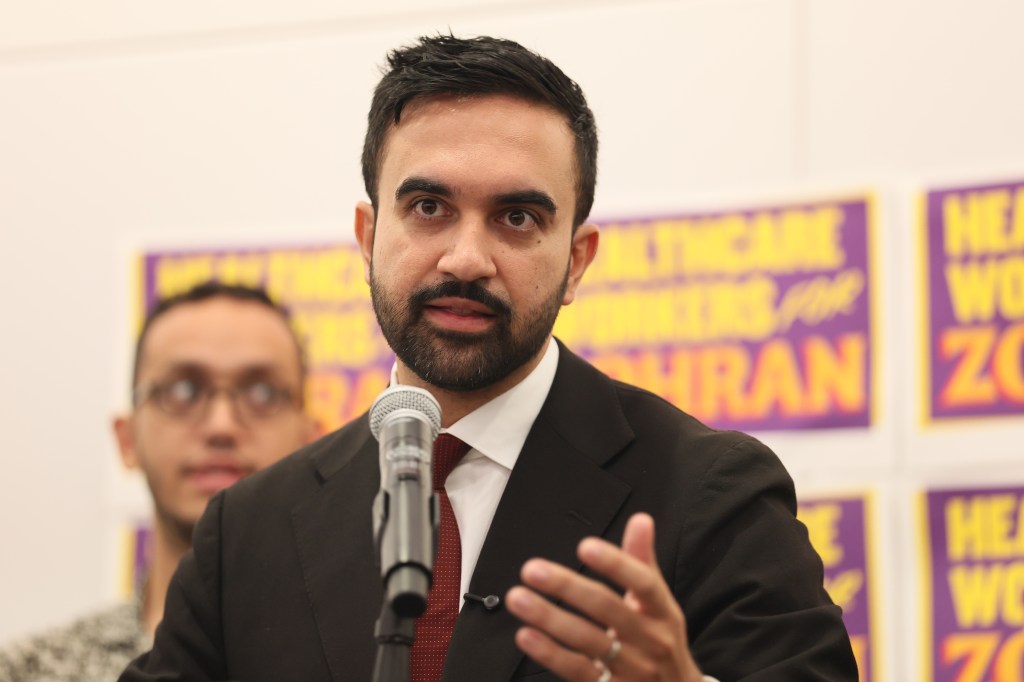 mamdani speaking at a microphone