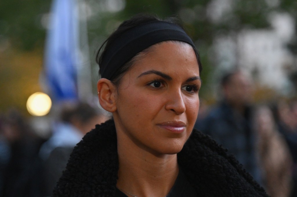 Photo of Natalie Sanandaji, a survivor of the Hamas attack on the Nova Festival, at a vigil in New York.