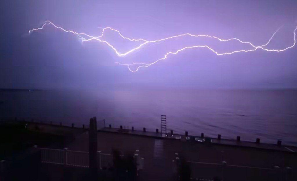 Lightning bolt over Bayport Long Island water.