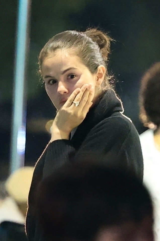 Selena Gomez in a black robe. 