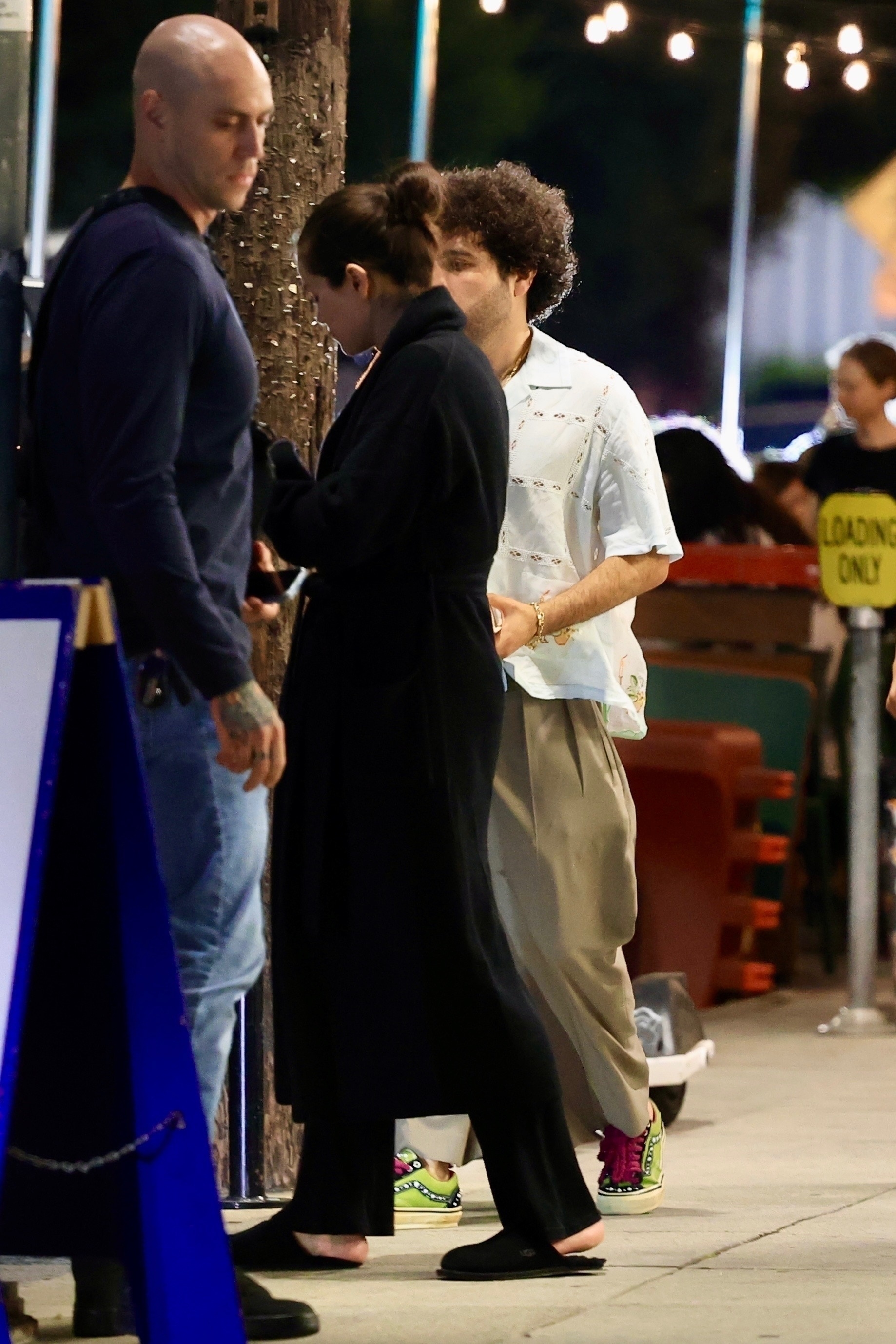Selena Gomez and Benny Blanco outdoors. 