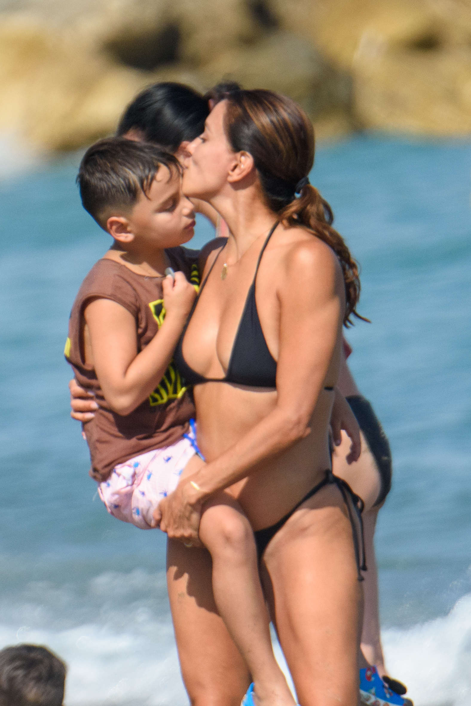 Eva Longoria kisses her son on the beach. 