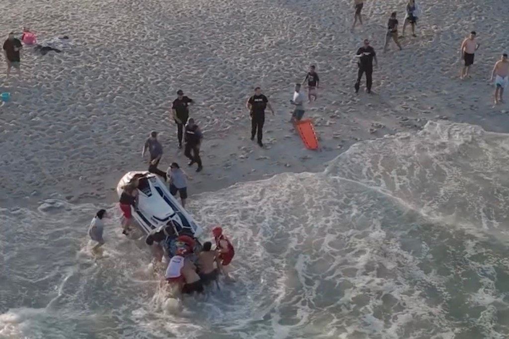 Rescue workers bringing six people to shore after a rip current incident.