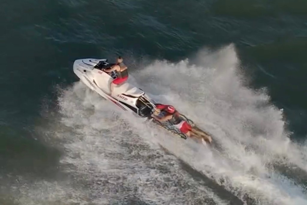Jet ski rescuing people from a rip current.