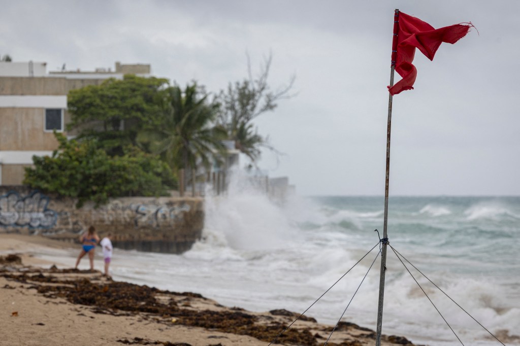 A ripped red flag warning of rip current waves as Hurricane Erin approached San Juan, Puerto Rico as a Category 5 storm on August 16, 2025.