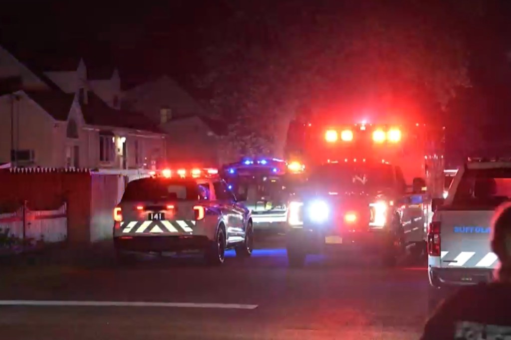 Police cars and an ambulance at the scene of the 11th Street shooting in West Babylon, NY on Aug. 15, 2025. 