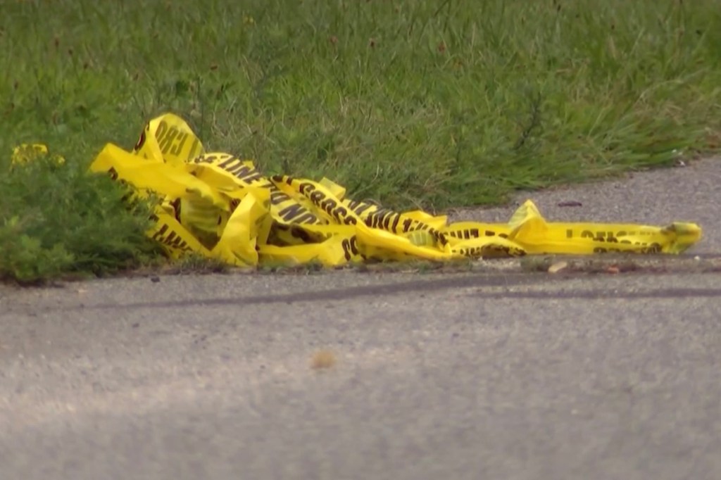 Police tape lies on the ground after the shooting on Aug. 15, 2025.