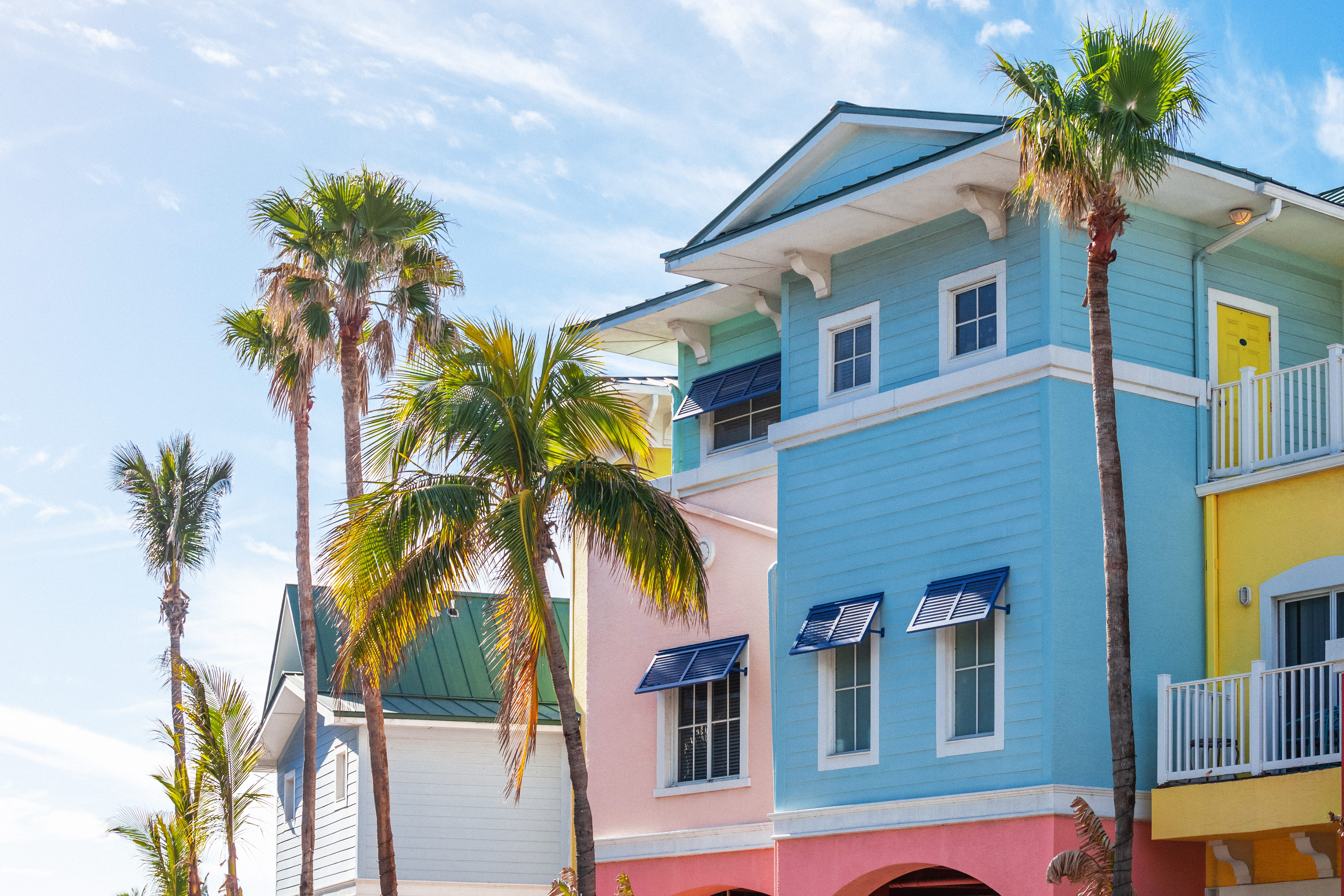 Colorful buildings and palm trees in Fort Myers, Florida.