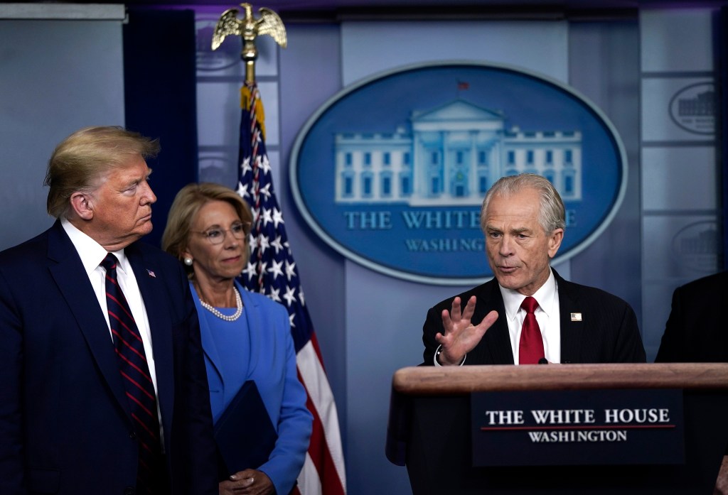 Peter Navarro speaking at a White House press briefing with President Trump and Betsy DeVos.