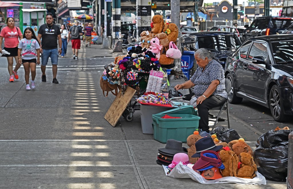 Illegal street vendors seen on Roosevelt Avenue near 89th Street in Jackson Heights on Aug. 17, 2025.