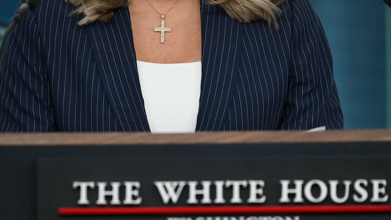 White House Press Secretary Karoline Leavitt wears a cross as she speaks during the daily briefing in the Brady Briefing Room of the White House in Washington, DC, on February 12, 2025. (Photo by ANDREW CABALLERO-REYNOLDS / AFP) (Photo by ANDREW CABALLERO-REYNOLDS/AFP via Getty Images)