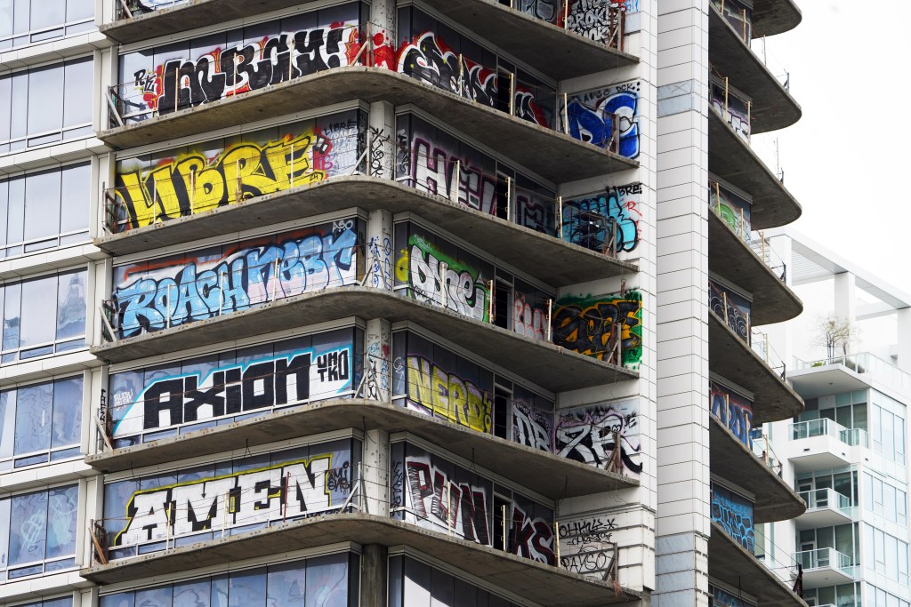 Graffiti seen on the side of Oceanwide Plaza. 