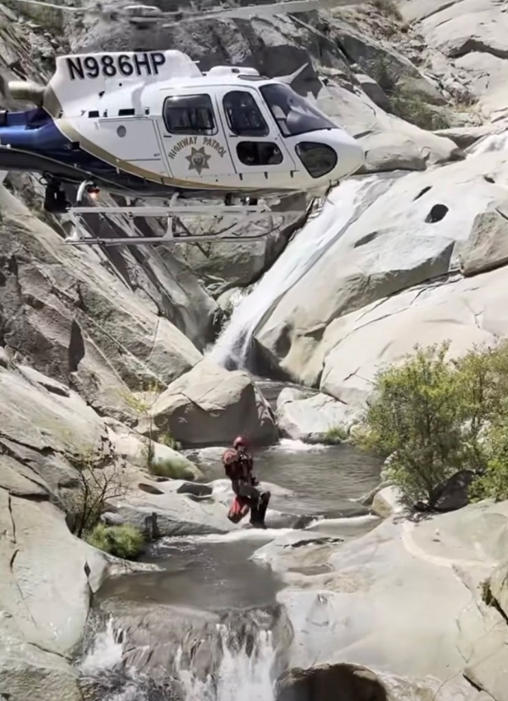 Helicopter rescue at a waterfall.