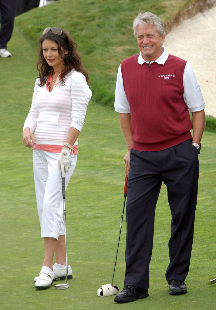 Catherine Zeta-Jones and Michael Douglas playing golf.