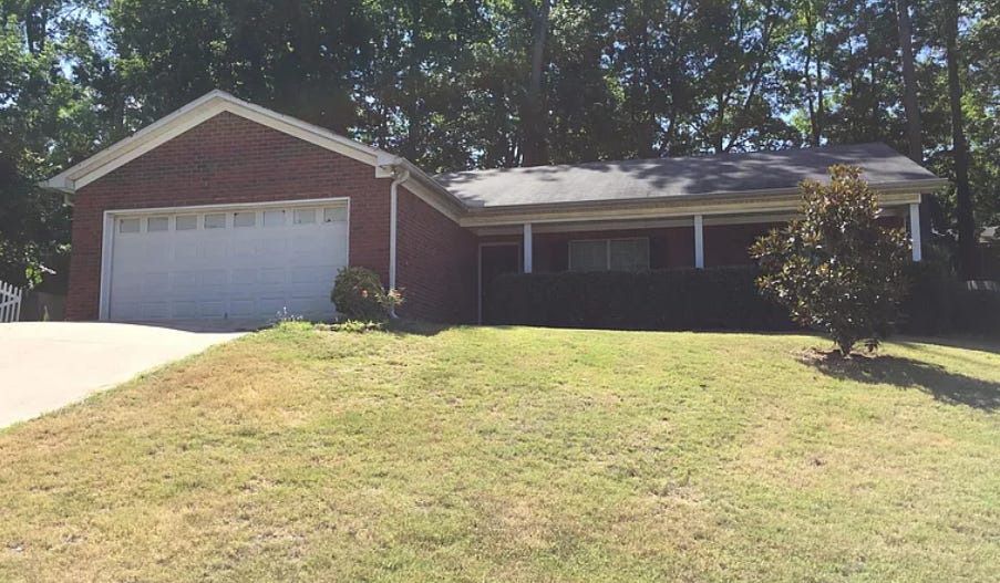 red brick home with large front lawn in georgia