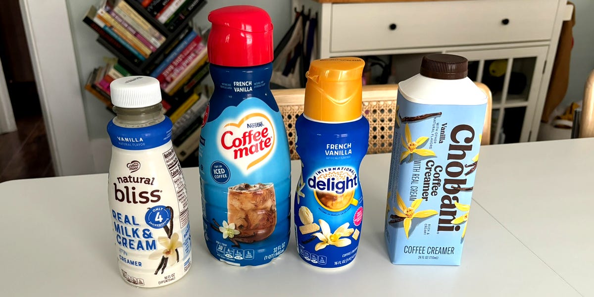 Coffee creamers lined up on table