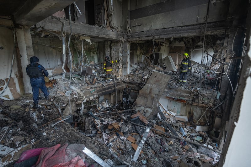 KHARKIV, UKRAINE - AUGUST 18: Rescuers clear the rubble in the destroyed apartment building after the Russian drone attack on August 18, 2025 in Kharkiv, Ukraine. In the morning, Russian Geran-2 drones attacked the Industrialnyi district. Five strikes hit a residential apartment building. Four people were killed, including two children. Another 18 people were injured, six of them children. (Photo by Hnat Holyk/Gwara Media/Global Images Ukraine via Getty Images)