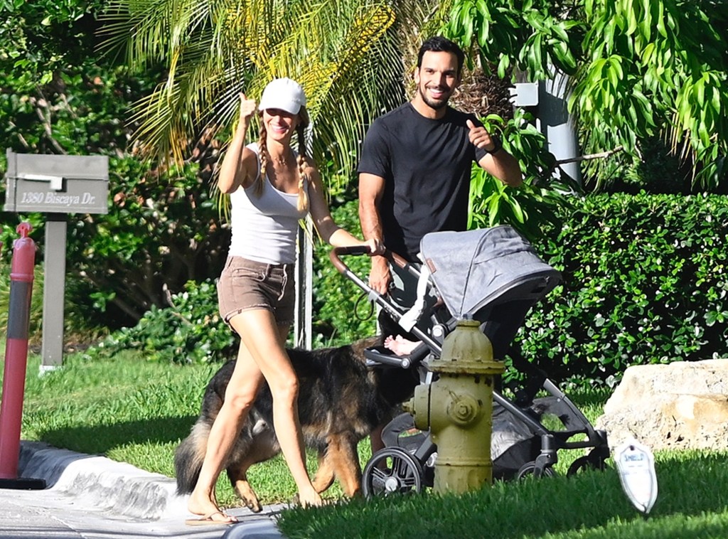 Gisele Bündchen and her fiancé Joaquim Valente are all smiles while out for a walk with their newborn and dog in Surfside, Florida.