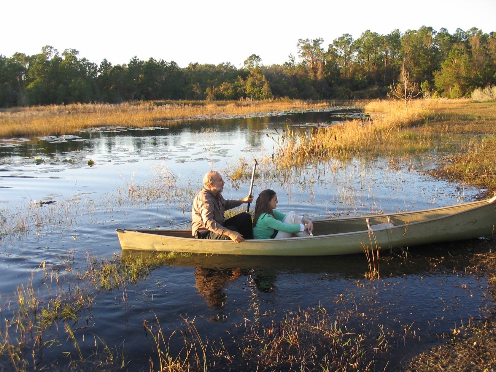 The author and her father in a canoe in Florida in 2004.