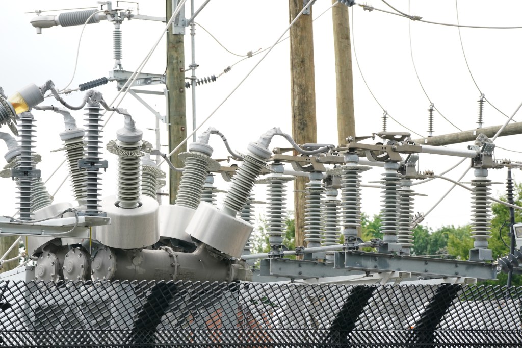 Close-up of electrical substation equipment.