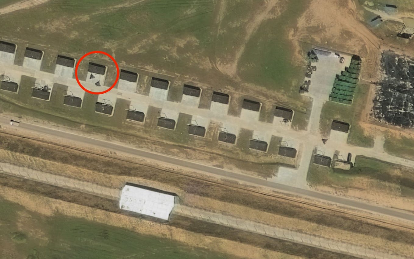 Shahed-style drones next to their storage facilities at the Tsimbulova drone base, in Russia's Oryol region, on August 14.