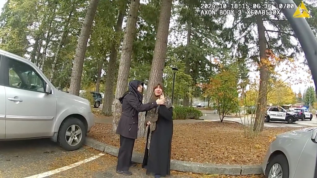 Women in headscarves seen on bodycam footage in the school parking lot