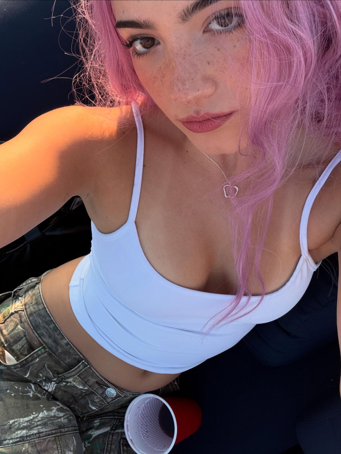 Charli D'Amelio rocks some pink locks.