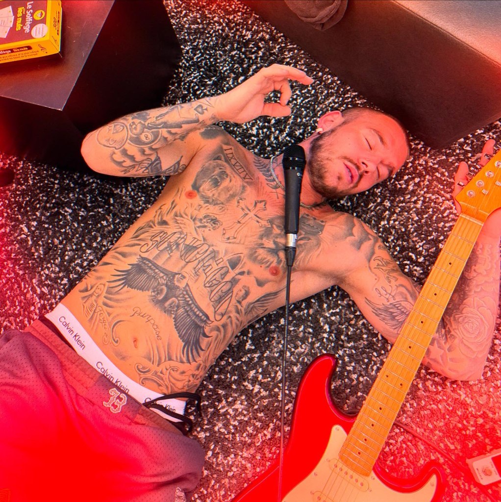 Dylan Desclos showing his tattoos. 