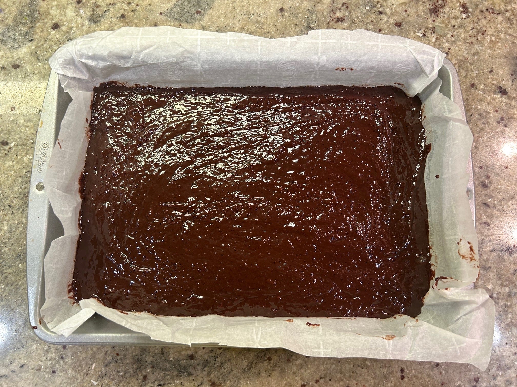 Putting Gordon Ramsay's Brownies in the oven