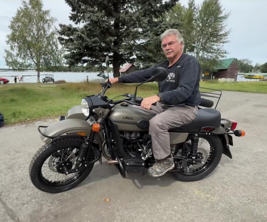 Mark Warren sitting on his new Ural motorcycle.